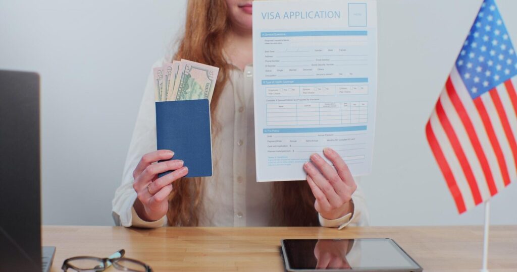 American migrant officer holding visa application passport with dollars payment id card services 299057 2145